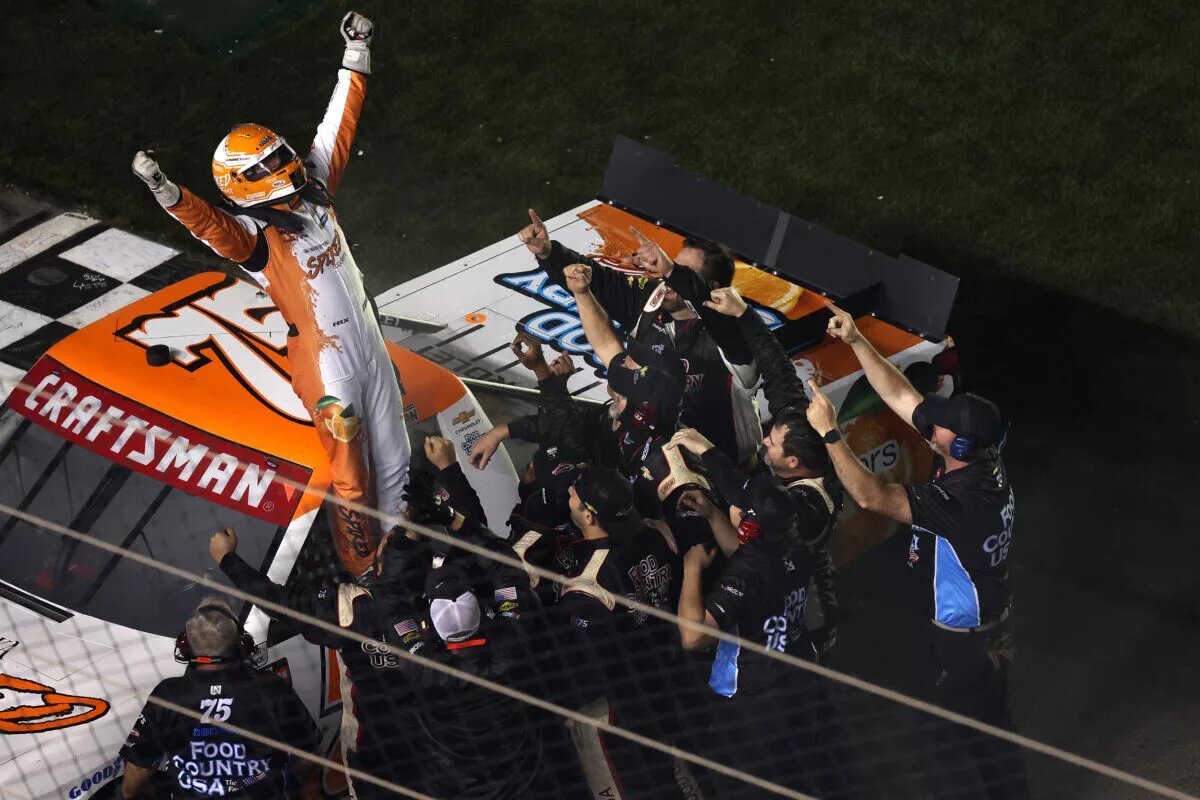 DAYTONA BEACH, FLORIDA - FEBRUARY 14: Parker Kligerman, driver of the #75 Spiked Coolers Chevrolet celebrates with his crew after winning the NASCAR Craftsman Truck Series Fresh from Florida 250 at Daytona International Speedway on February 14, 2025 in Daytona Beach, Florida. (Photo by Meg Oliphant/Getty Images)