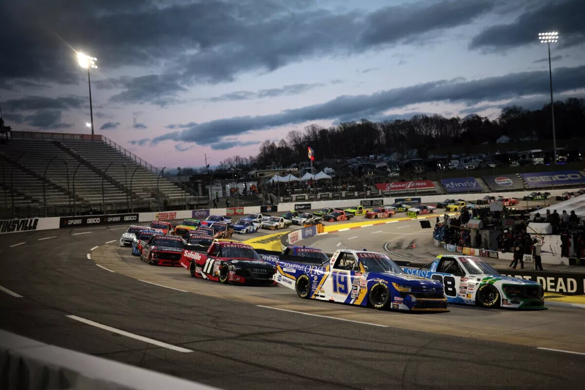 MARTINSVILLE, VIRGINIA - APRIL 05: Christian Eckes, driver of the #19 Adaptive One Calipers Chevrolet, and Ty Majeski, driver of the #98 Soda Sense/Curb Records Ford, lead the field during the NASCAR Craftsman Long John Silver's 200 at Martinsville Speedway on April 05, 2024 in Martinsville, Virginia. (Photo by James Gilbert/Getty Images)
