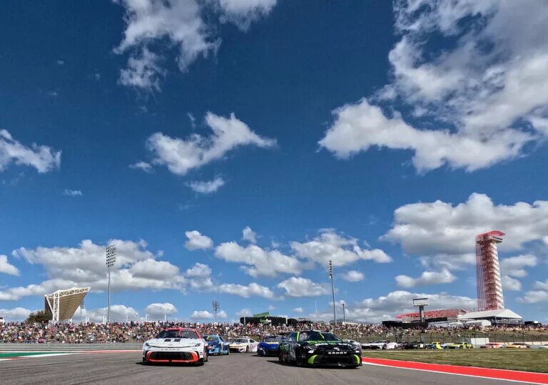 AUSTIN, TEXAS - MARCH 02: Tyler Reddick, driver of the #45 The Beast Toyota, and Bubba Wallace, driver of the #23 Mobil 1 Toyota, lead the field on a pace lap prior to the NASCAR Cup Series EchoPark Automotive Grand Prix at Circuit of The Americas on March 02, 2025 in Austin, Texas. (Photo by James Gilbert/Getty Images)