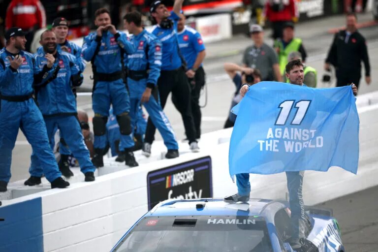 MARTINSVILLE, VIRGINIA - MARCH 30: Denny Hamlin, driver of the #11 Progressive Toyota, and crew celebrate after winning the NASCAR Cup Series Cook Out 400 at Martinsville Speedway on March 30, 2025 in Martinsville, Virginia. (Photo by Jared C. Tilton/Getty Images
