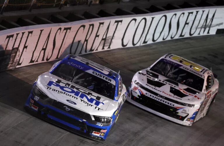 BRISTOL, TENNESSEE - SEPTEMBER 20: Cole Custer, driver of the #00 HighPoint.com Ford, and Shane Van Gisbergen, driver of the #97 WeatherTech Chevrolet, race during the NASCAR Xfinity Series Food City 300 at Bristol Motor Speedway on September 20, 2024 in Bristol, Tennessee. (Photo by James Gilbert/Getty Images)