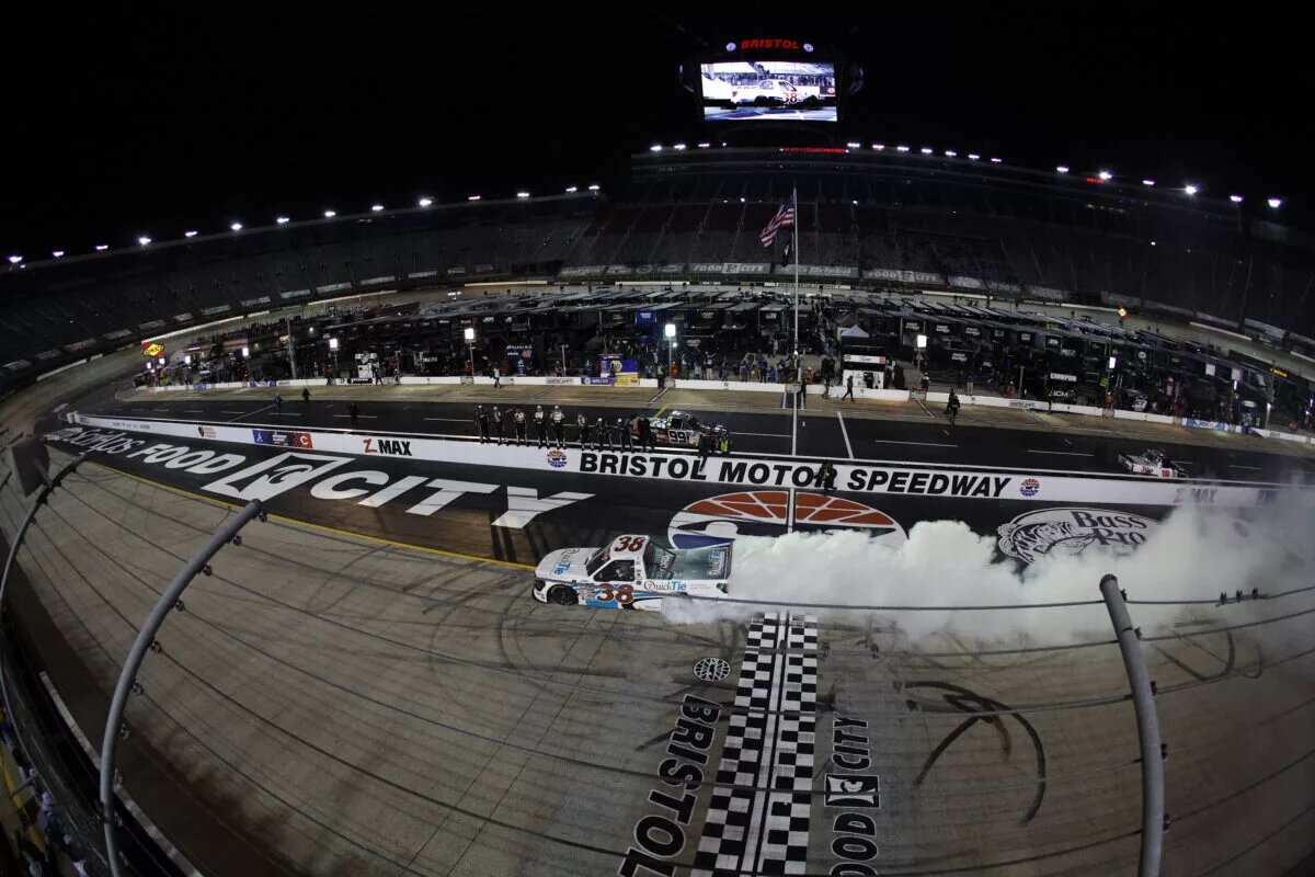 BRISTOL, TENNESSEE - APRIL 11: Chandler Smith, driver of the #38 QuickTie Ford, celebrates after winning the NASCAR Craftsman Truck Series Weather Guard Truck Race at Bristol Motor Speedway on April 11, 2025 in Bristol, Tennessee