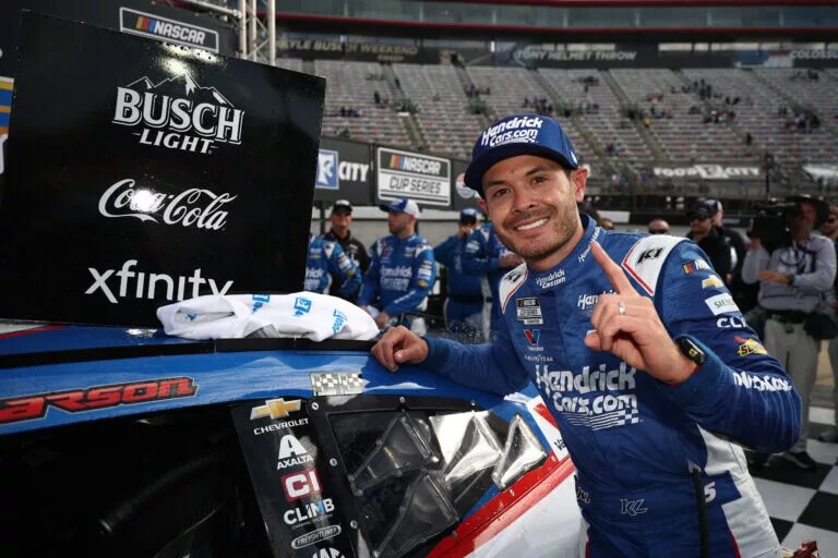 BRISTOL, TENNESSEE - APRIL 13: Kyle Larson, driver of the #5 HendrickCars.com Chevrolet, celebrates in victory lane by placing the winner's sticker on his car after winning the NASCAR Cup Series Food City 500 at Bristol Motor Speedway on April 13, 2025 in Bristol, Tennessee. (Photo by Jared C. Tilton/Getty Images)