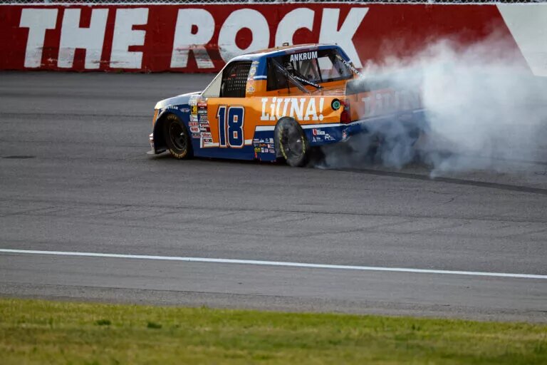 ROCKINGHAM, NORTH CAROLINA - APRIL 18: Tyler Ankrum, driver of the #18 LiUNA! Chevrolet, celebrates with a burnout after winning the NASCAR Craftsman Truck Series Weather Guard Truck Race at Rockingham Speedway on April 18, 2025 in Rockingham, North Carolina. (Photo by James Gilbert/Getty Images)