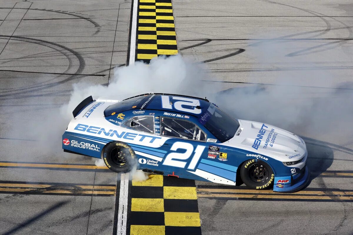 TALLADEGA, ALABAMA - APRIL 26: Austin Hill, driver of the #21 Bennett Transportation Chevrolet, celebrates with a burnout after winning the NASCAR Xfinity Series Ag-Pro 300 at Talladega Superspeedway on April 26, 2025 in Talladega, Alabama. (Photo by Logan Riely/Getty Images)