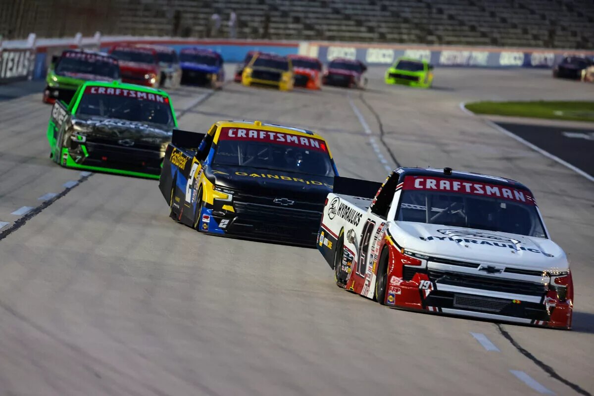 FORT WORTH, TEXAS - APRIL 12: Christian Eckes, driver of the #19 Gates Hydraulics Chevrolet, Nick Sanchez, driver of the #2 Gainbridge Chevrolet, and Kyle Busch, driver of the #7 Realtree Chevrolet, race during the NASCAR Craftsman Truck Series SpeedyCash.com 250 at Texas Motor Speedway on April 12, 2024 in Fort Worth, Texas.