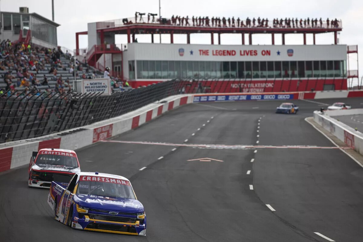 NORTH WILKESBORO, NORTH CAROLINA - MAY 17: Christian Eckes, driver of the #19 Instacoat Premium Products Chevrolet, and Ty Majeski, driver of the #98 Road Ranger Ford, drive during practice for the NASCAR Craftsman Truck Series Wright Brand 250 at North Wilkesboro Speedway on May 17, 2024 in North Wilkesboro, North Carolina. Chandler Smith