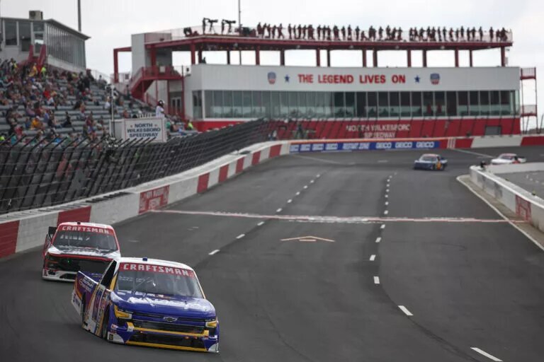 NORTH WILKESBORO, NORTH CAROLINA - MAY 17: Christian Eckes, driver of the #19 Instacoat Premium Products Chevrolet, and Ty Majeski, driver of the #98 Road Ranger Ford, drive during practice for the NASCAR Craftsman Truck Series Wright Brand 250 at North Wilkesboro Speedway on May 17, 2024 in North Wilkesboro, North Carolina. Chandler Smith