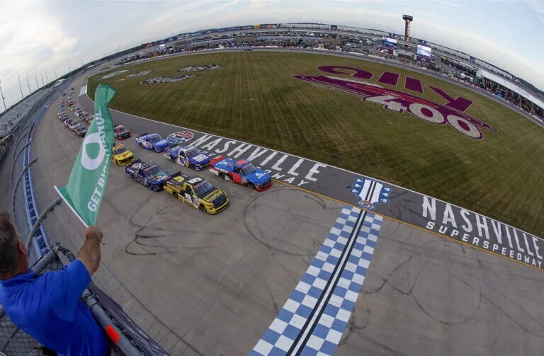 LEBANON, TENNESSEE - JUNE 28: Stewart Friesen, driver of the #52 Halmar International Toyota, leads the field to the green flag to start the NASCAR Craftsman Truck Series Rackley Roofing 200 at Nashville Superspeedway on June 28, 2024 in Lebanon, Tennessee. (Photo by Sean Gardner/Getty Images)