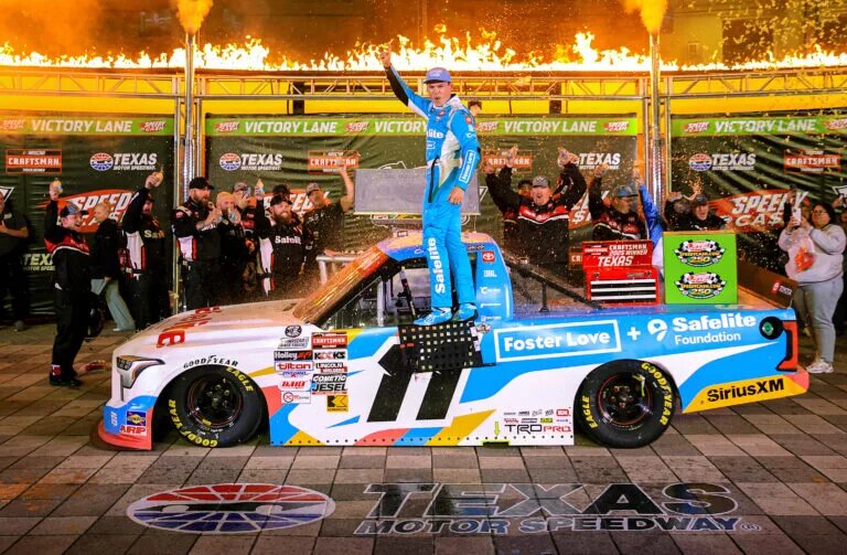 FORT WORTH, TEXAS - MAY 02: Corey Heim, driver of the #11 Safelite/Foster Love Toyota, celebrates in victory lane after winning the NASCAR Craftsman Truck Series SpeedyCash.com 250 at Texas Motor Speedway on May 02, 2025 in Fort Worth, Texas.