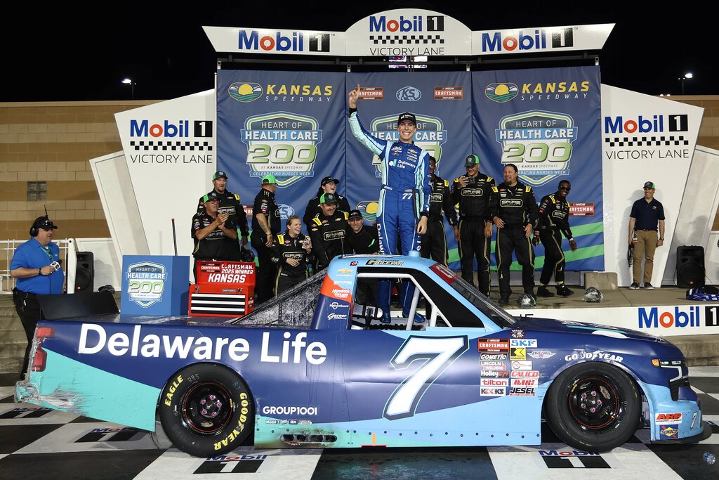 KANSAS CITY, KANSAS - MAY 10: Carson Hocevar, driver of the #7 Delaware Life Chevrolet, celebrates in victory lane after winning the NASCAR Craftsman Truck Series Heart of Health Care 200 at Kansas Speedway on May 10, 2025 in Kansas City, Kansas. (Photo by Chris Graythen/Getty Images)