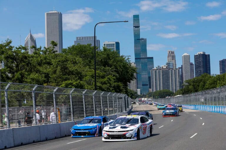CHICAGO, ILLINOIS - JULY 06: Shane Van Gisbergen, driver of the #97 WeatherTech Chevrolet, and Kyle Larson, driver of the #17 HendrickCars.com Chevrolet, lead the field during the NASCAR Xfinity Series The Loop 110 at Chicago Street Course on July 06, 2024 in Chicago, Illinois. (Photo by Meg Oliphant/Getty Images)