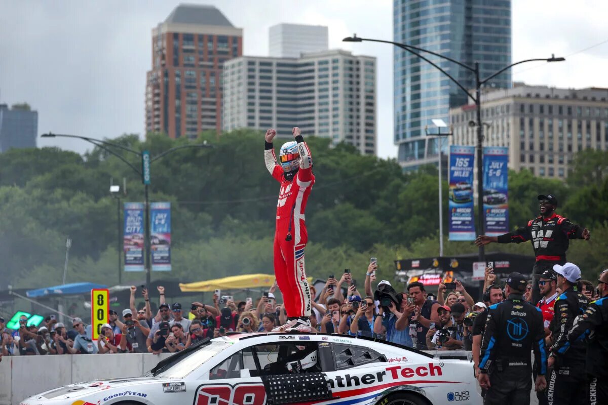 Shane Van Gisbergen, driver of the #88 WeatherTech Chevrolet, and crew celebrate after winning the NASCAR Cup Series Grant Park 165 at Chicago Street Course on July 06, 2025 in Chicago, Illinois. (Photo by James Gilbert/Getty Images)