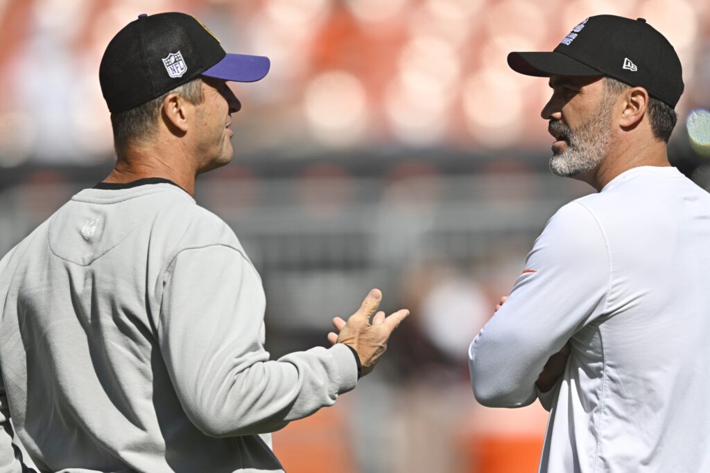 Kevin Stefanski gives the game ball to DC Jim Schwartz after