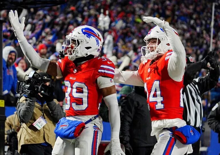 Cole Bishop and Cam Lewis of the Buffalo Bills