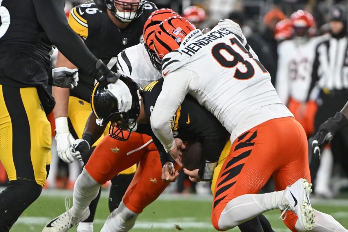 Jan 4, 2025; Pittsburgh, Pennsylvania, USA; Cincinnati Bengals defensive end Trey Hendrickson (91) sacks Pittsburgh Steelers quarterback Russell Wilson (3) during the first quarter at Acrisure Stadium. Mandatory Credit: Barry Reeger-Imagn Images