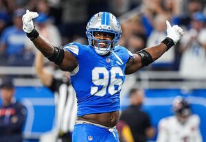 Al-Quadin Muhammad celebrates tackle against Chicago Bears on September 14, 2025 