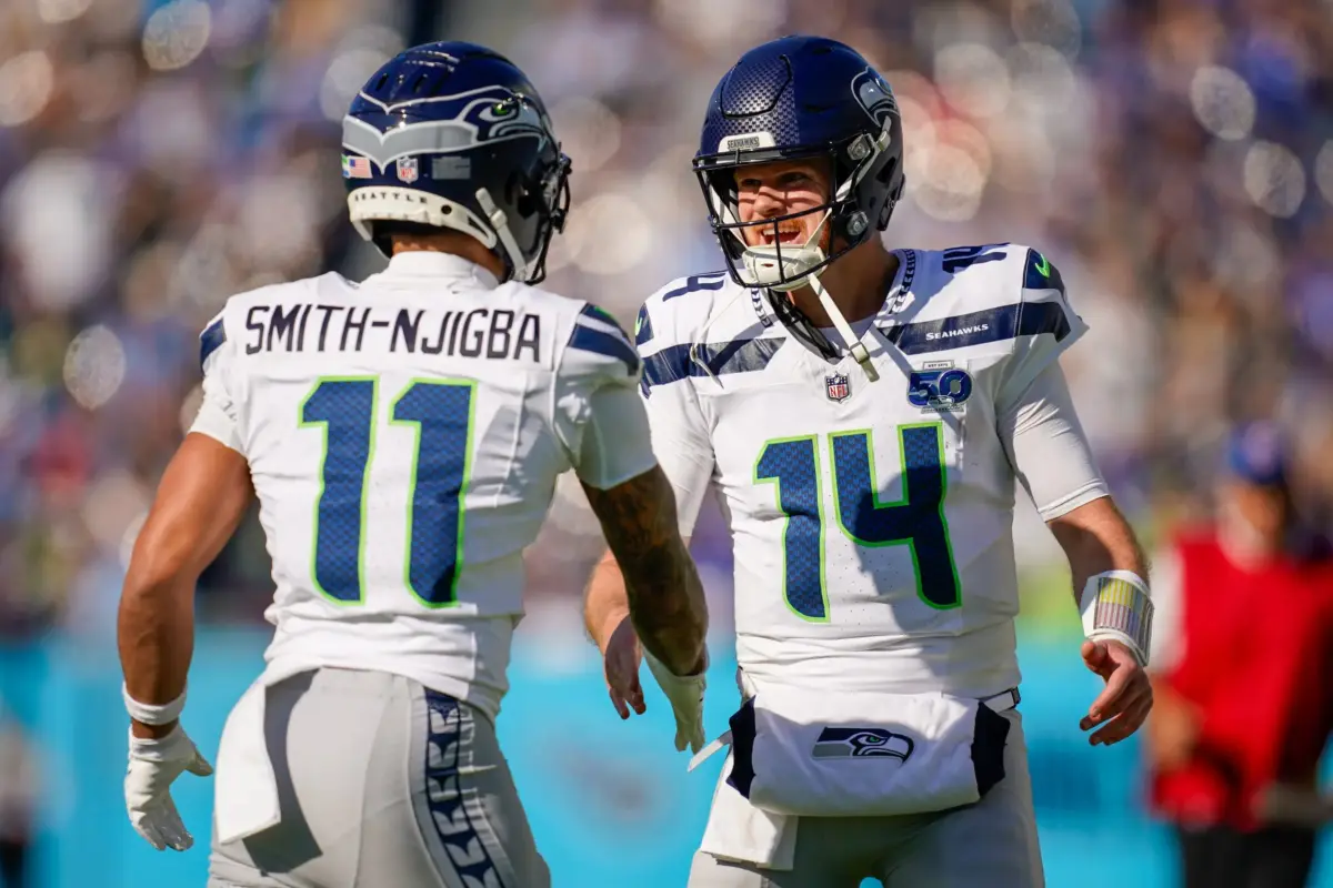 Jaxon Smith-Njigba and Sam Darnold of the Seattle Seahawks