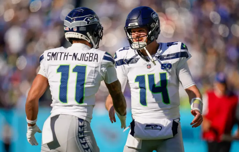 Jaxon Smith-Njigba and Sam Darnold of the Seattle Seahawks