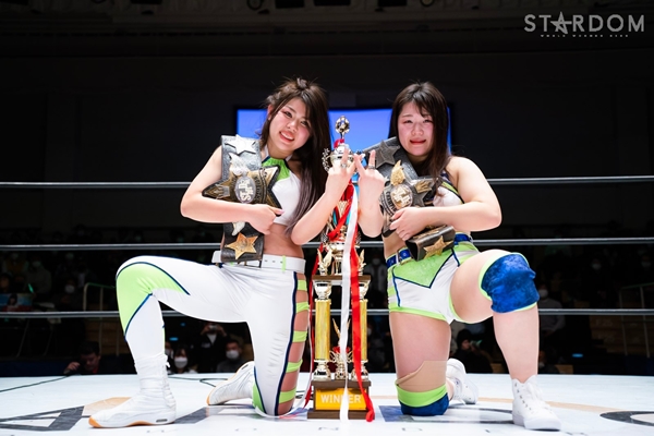 Hazuki & Kogua after winning the tag titles