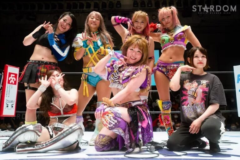 Cosmic Angels members pose with COLOR's after match