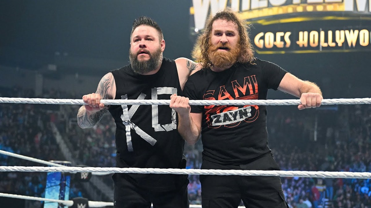Kevin Owens and Sami Zayn standing in the wrestling ring