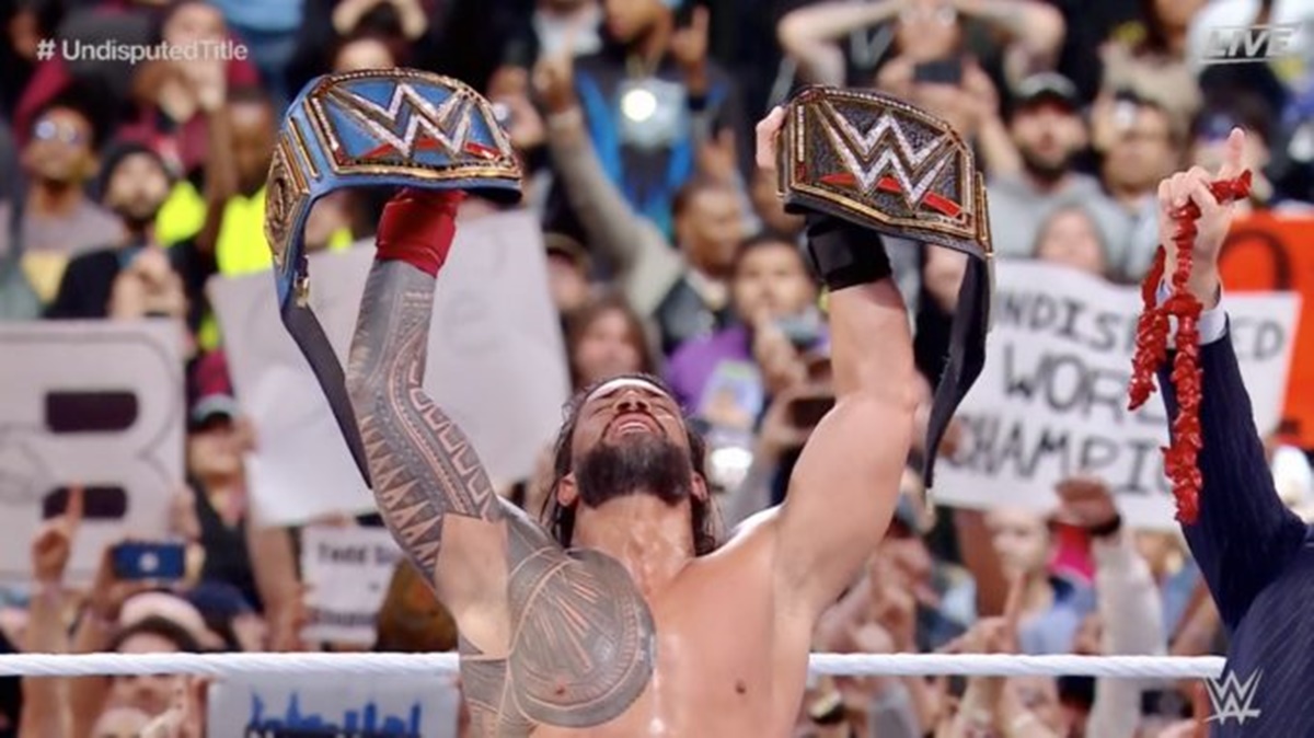 Roman Reigns raises his WWE Undisputed Championship after defeating Cody Rhodes at WrestleMania 39