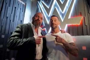 CM Punk posing with Triple H after his return to the company at WWE Survivor Series 2023.