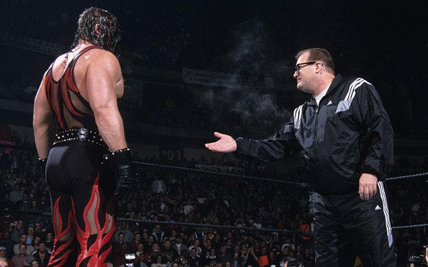 A photo of WWE Hall of Fame member Drew Carey with Kane.