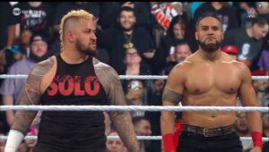 A photo of Tama Tonga in his WWE debut alongside The Bloodline member Solo Sikoa.