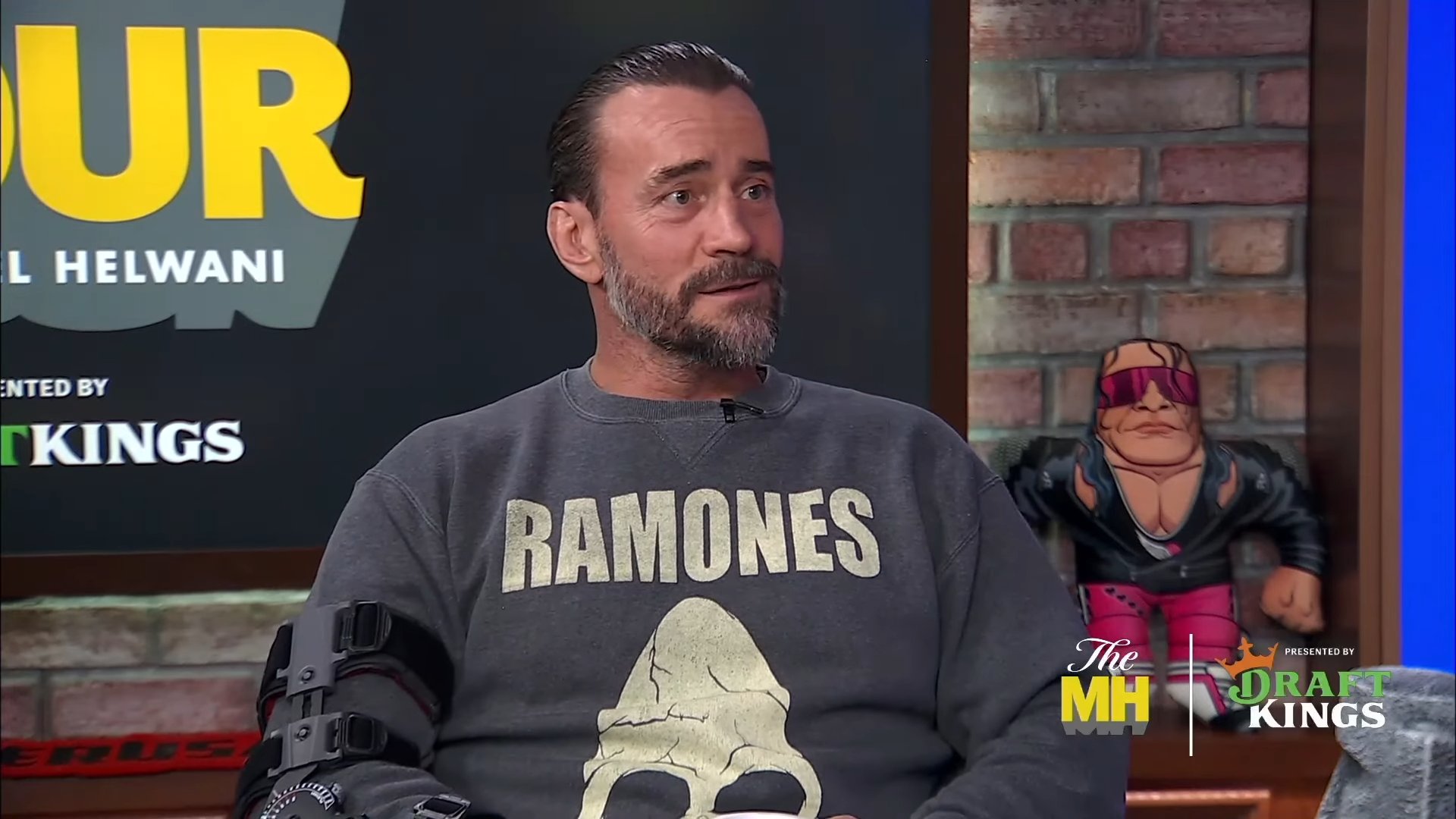 A photo of CM Punk on "The MMA Hour" podcast.