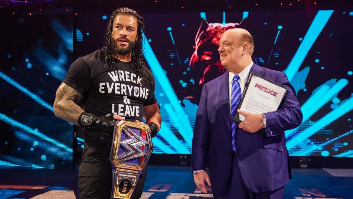 A photo of WWE megastar Roman Reigns with Paul Heyman.