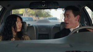 A photo of John Cena and Awkwafina from the movie "Jackpot."