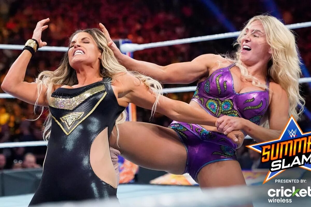 A photo of Trish Stratus and Charlotte Flair at WWE SummerSlam.