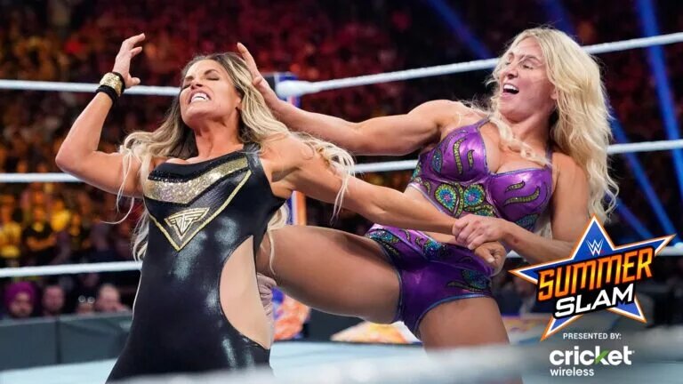 A photo of Trish Stratus and Charlotte Flair at WWE SummerSlam.