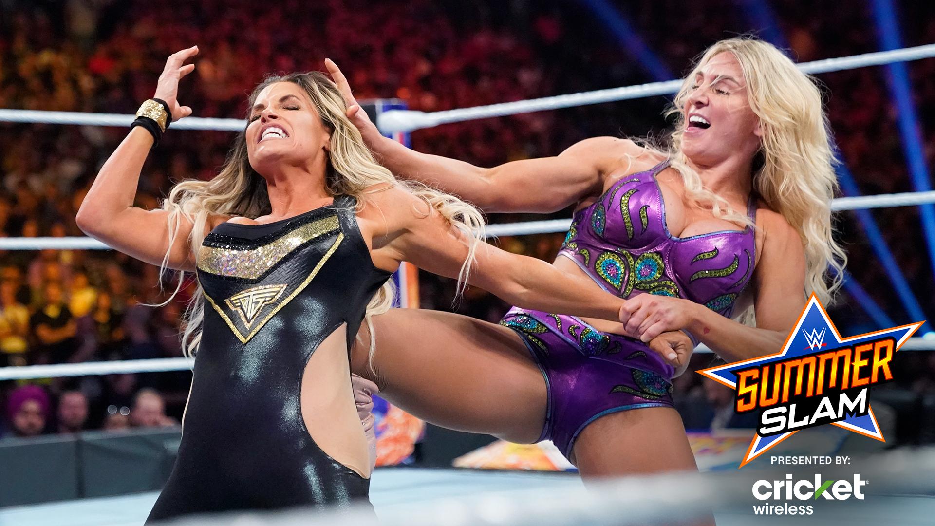 A photo of Trish Stratus and Charlotte Flair at WWE SummerSlam.
