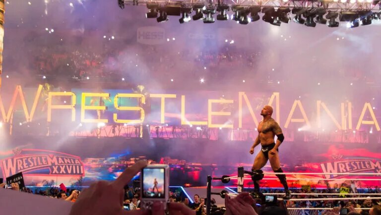 Cena vs. The Rock vs. Batista: Is It Too Much To Ask? [Ed Webster, CC BY 2.0 , via Wikimedia Commons]