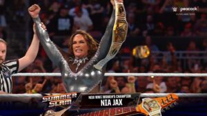 A photo of Nia Jax winning the WWE Women's Championship at WWE SummerSlam 2024.