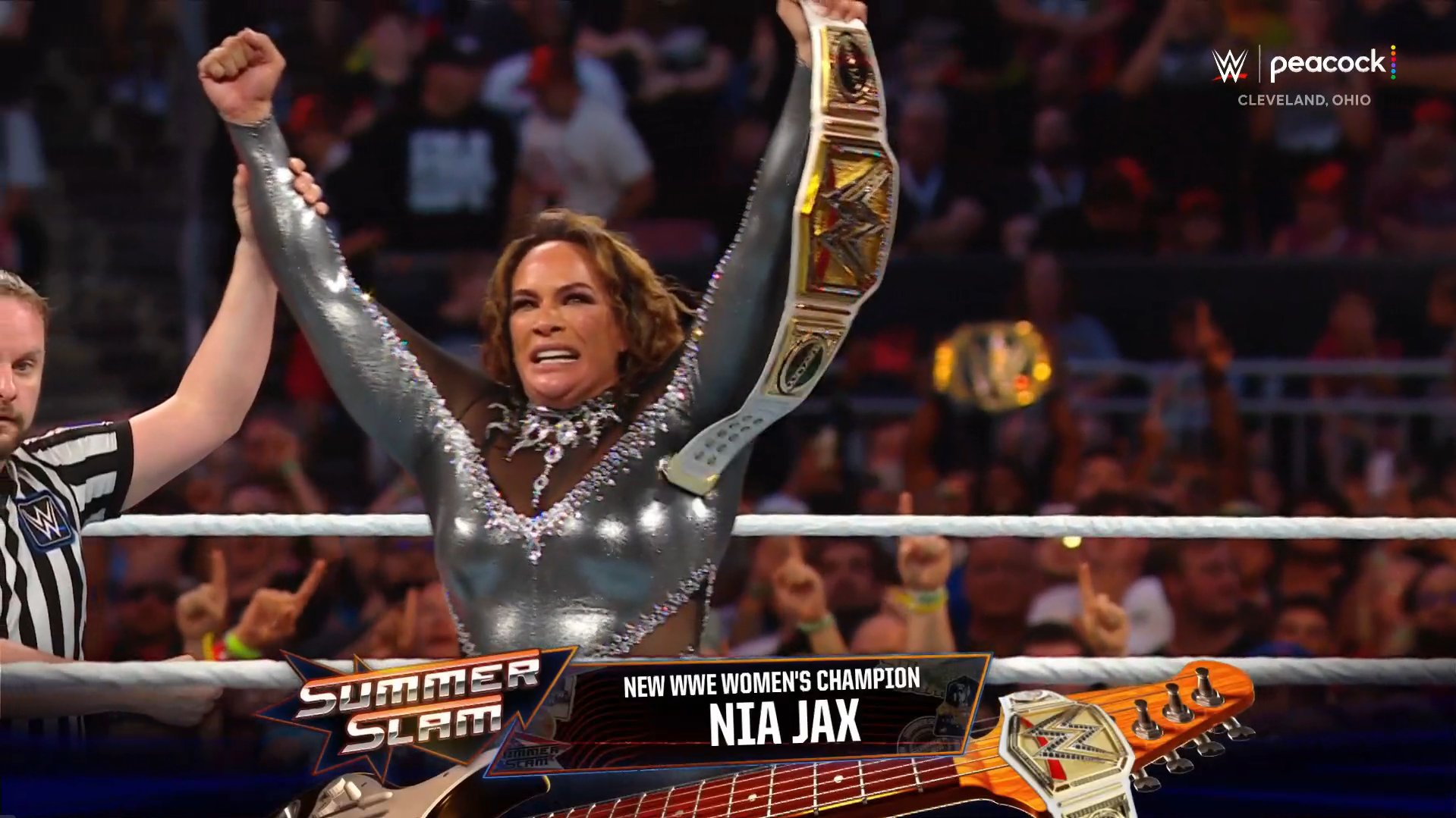 A photo of Nia Jax winning the WWE Women's Championship at WWE SummerSlam 2024.