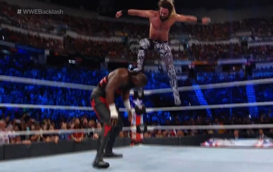 A photo of WWE Superstar Seth Rollins doing his finishing move the "Curb Stomp."