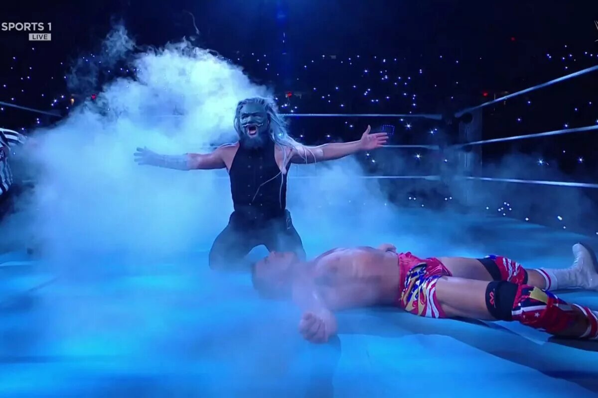 A photo of Uncle Howdy beating Chad Gable on WWE Raw.