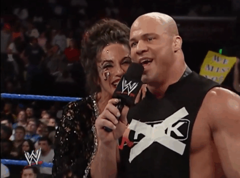 A photo of Kurt Angle with Sensational Sherri, one of the best WWE Golden Era managers of all-time, on WWE SmackDown.