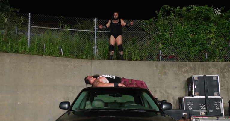 A photo of Brunson Reed about to hit the Tsunami on Braun Strowman on WWE Raw.