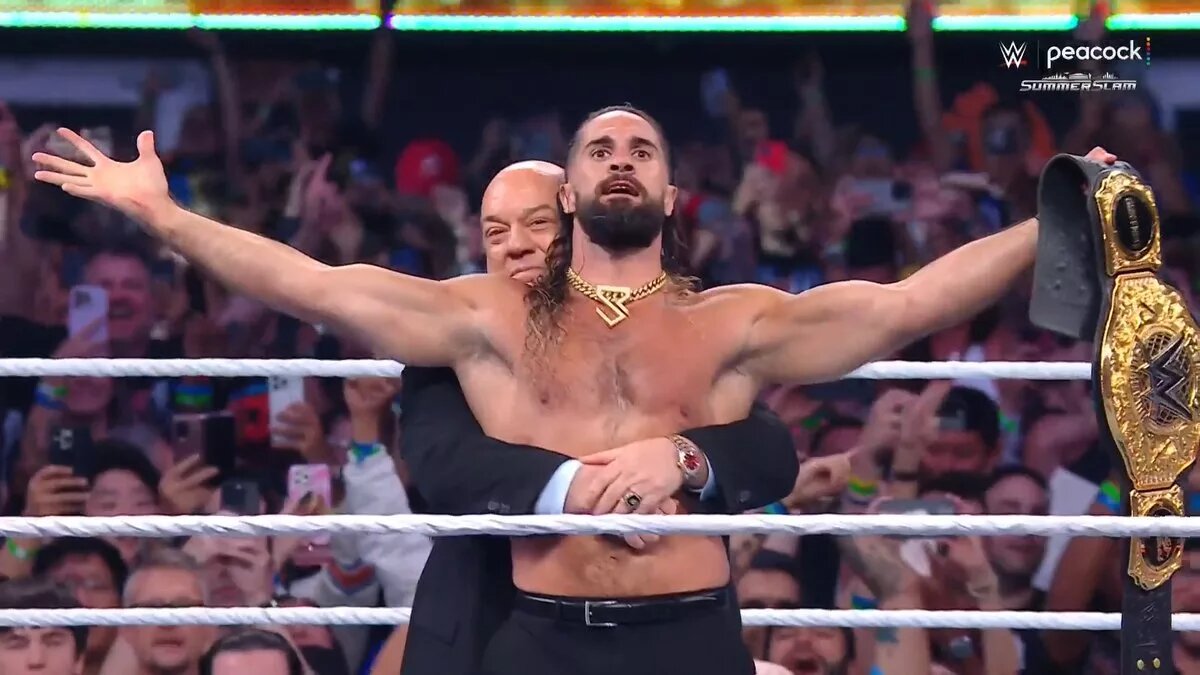 A photo of Seth Rollins and Paul Heyman