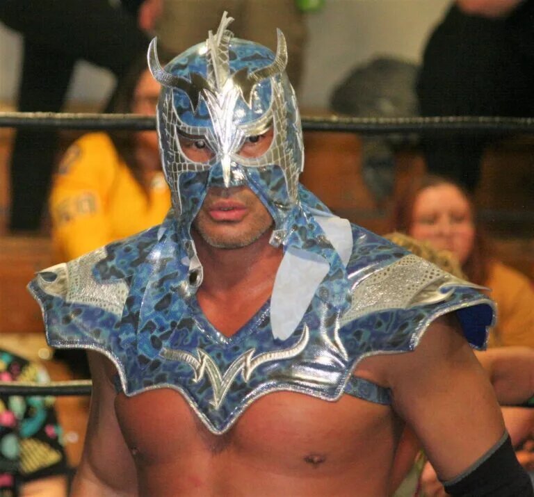 A photo of one of the most famous pro wrestling belt collectors, Ultimo Dragon.