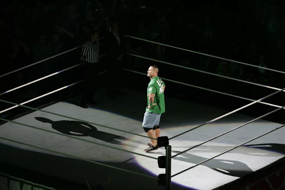 A photo of WWE legend, John Cena, who's had 17 WWE world title reigns.