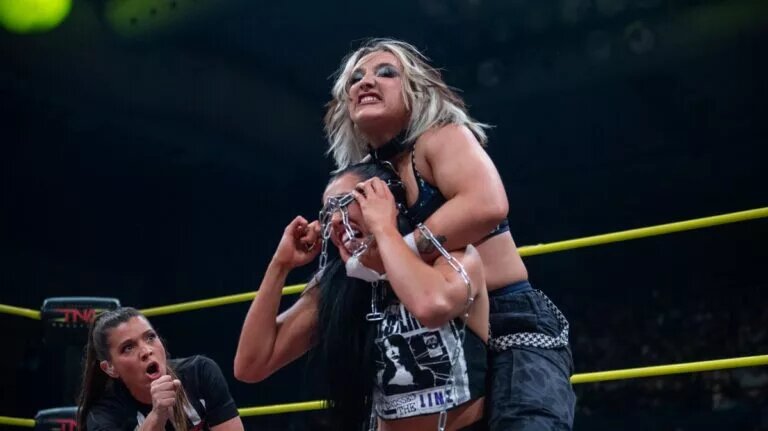 A graphic of the TNA iMPACT Results of December 11, 2025, with Dani Luna and Indi Hartwell in a Dog Collar match.