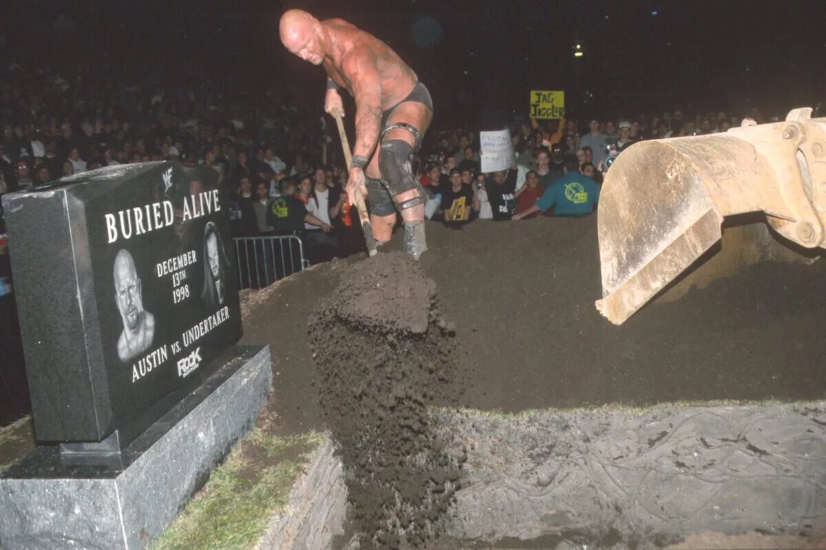 A graphic of The Buried Alive match between Stone Cold Steve Austin and The Undertaker at RIck Bottom 1998