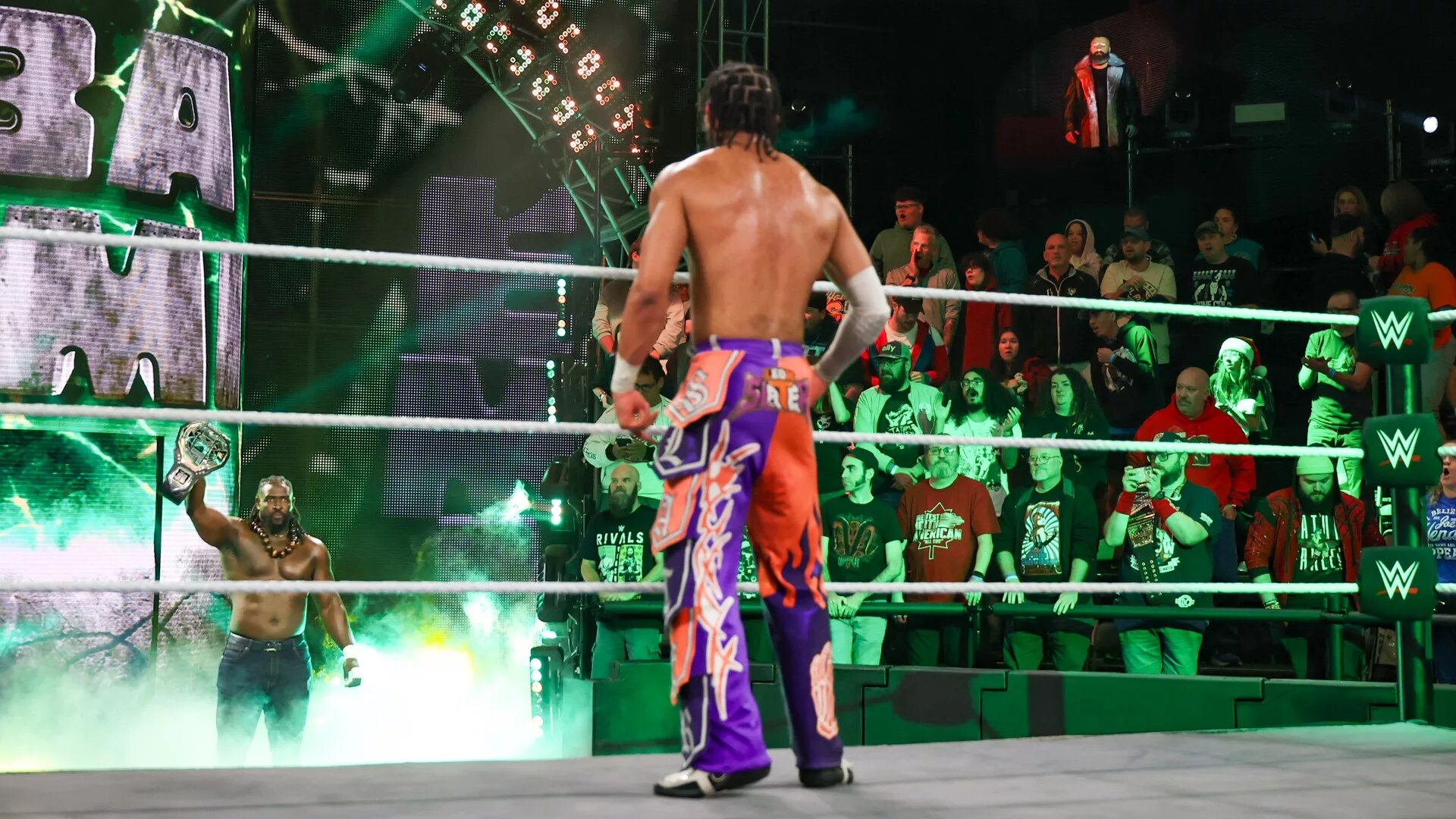 A graphic of Oba Femi and TNA X-Division Champion Leon Slater as they face for the NXT Championship on Tuesday January 6 at NXT New YEar's Evil