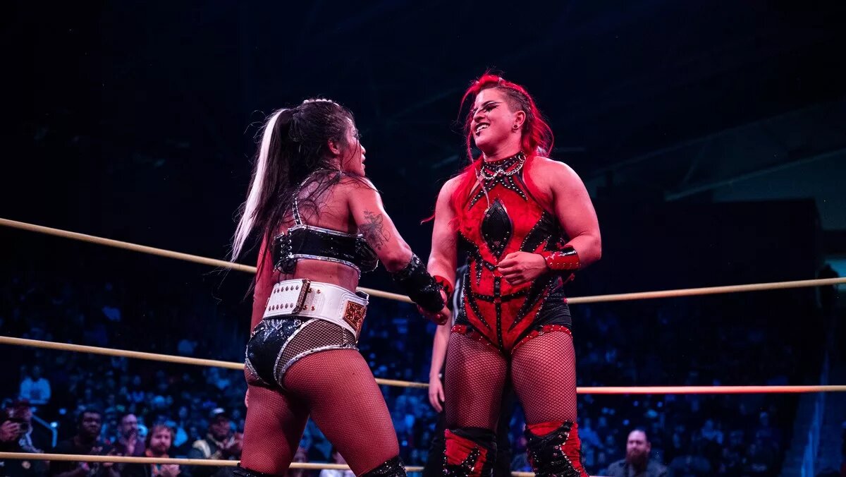 Zaria shook Léi Ying Lee's hand after Lee retained the TNA knockouts World Championship at TNA Genesis